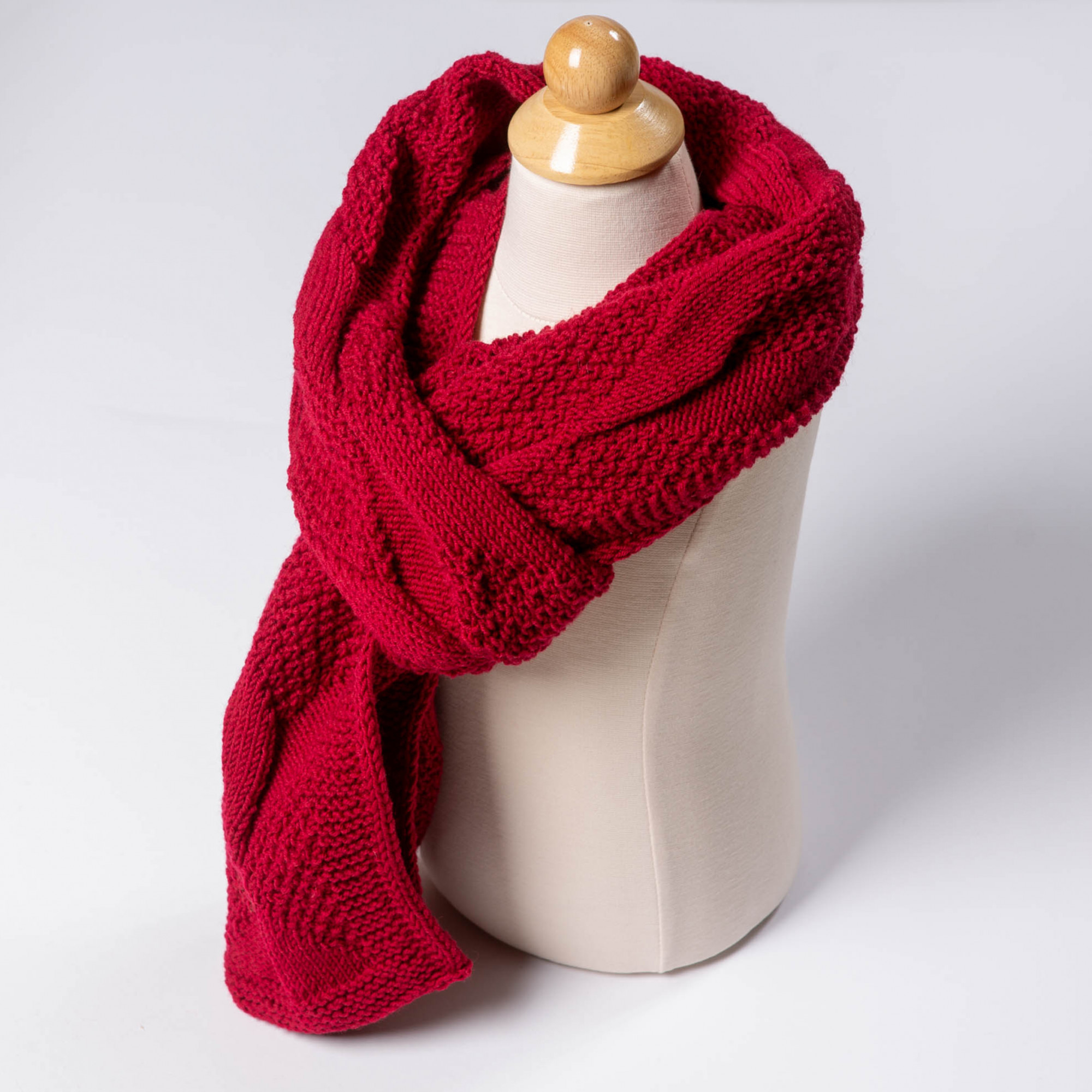 Soft red hand-knitted wool scarf
