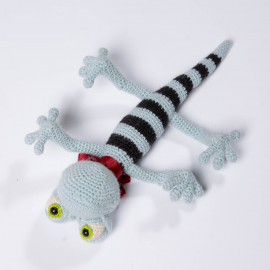 The lizard is a toy for a kid. Blue funny reptile