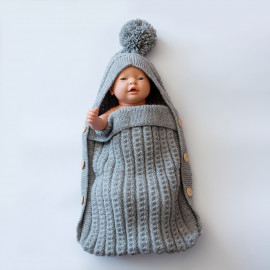Hand-knitted envelope for newborns. Warm envelope for a walk