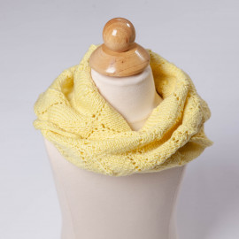 Hand-knitted kerchief on the neck. Yellow scarf for a girl