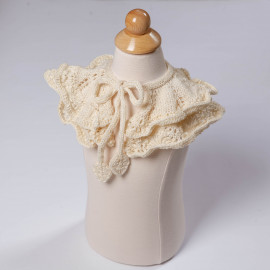 Openwork knit cape. Beige cape for the shoulders for the girl.
