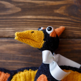 Hand crocheted toy, Orange Pterodactyl, the earliest bird